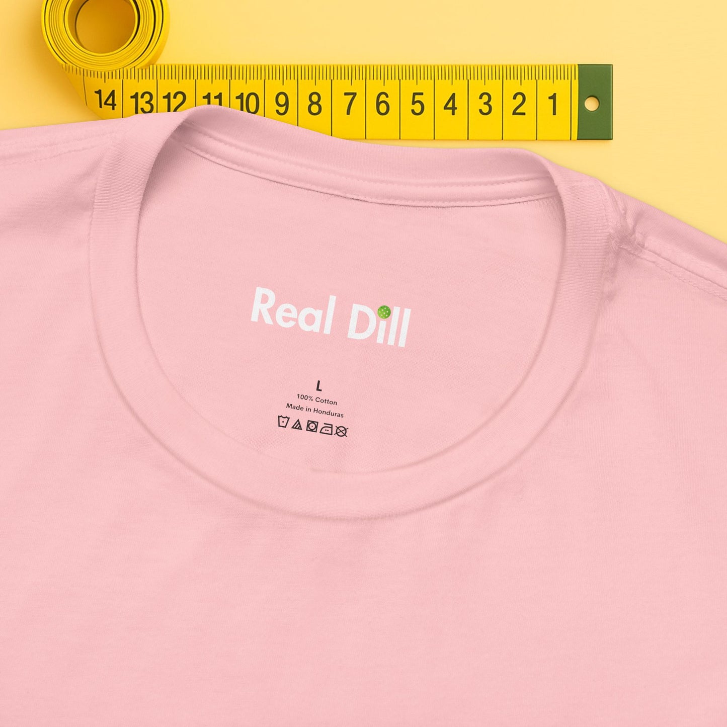 pink close-up of neck label – real dill pickleball shirt branding