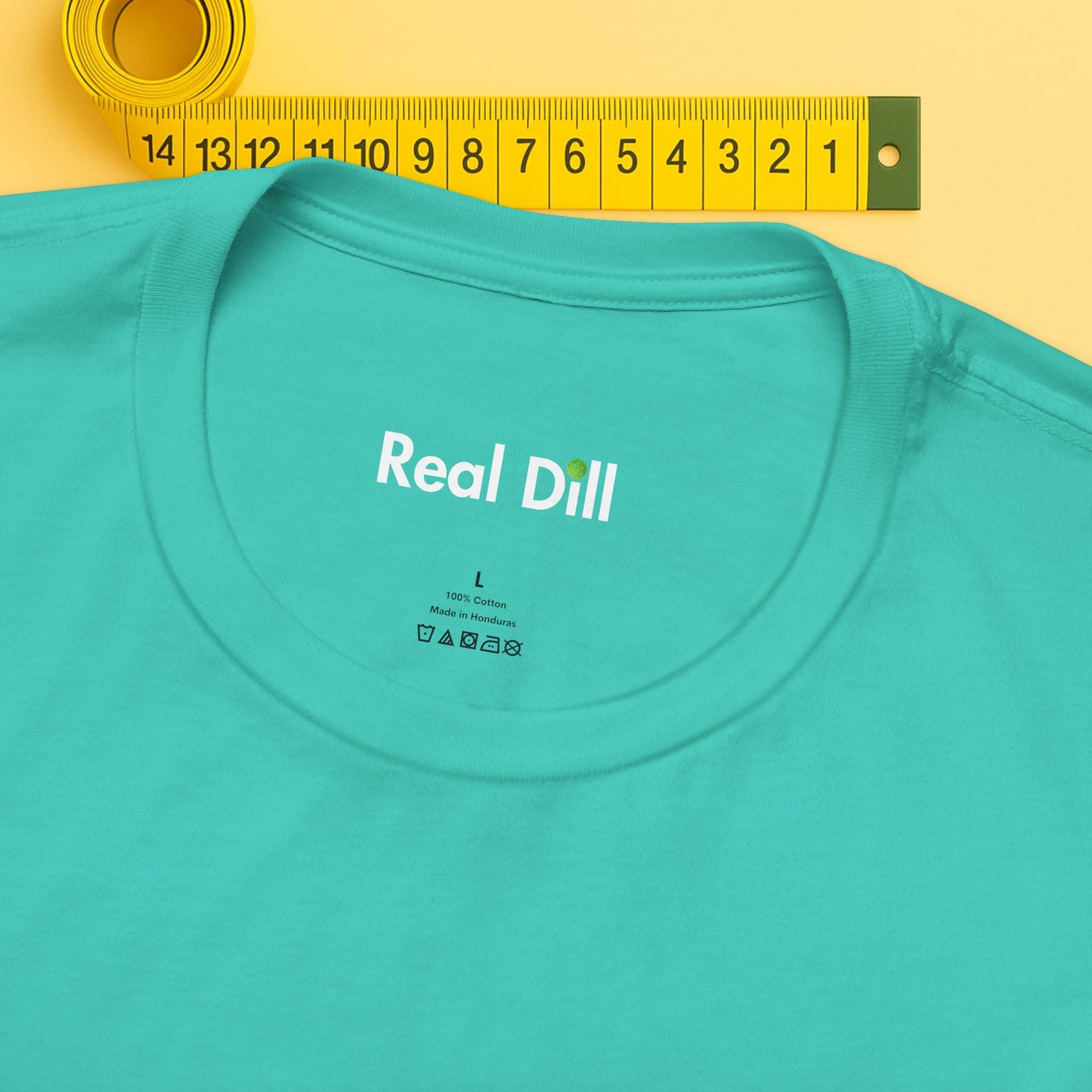 green close-up of neck label – real dill pickleball shirt branding